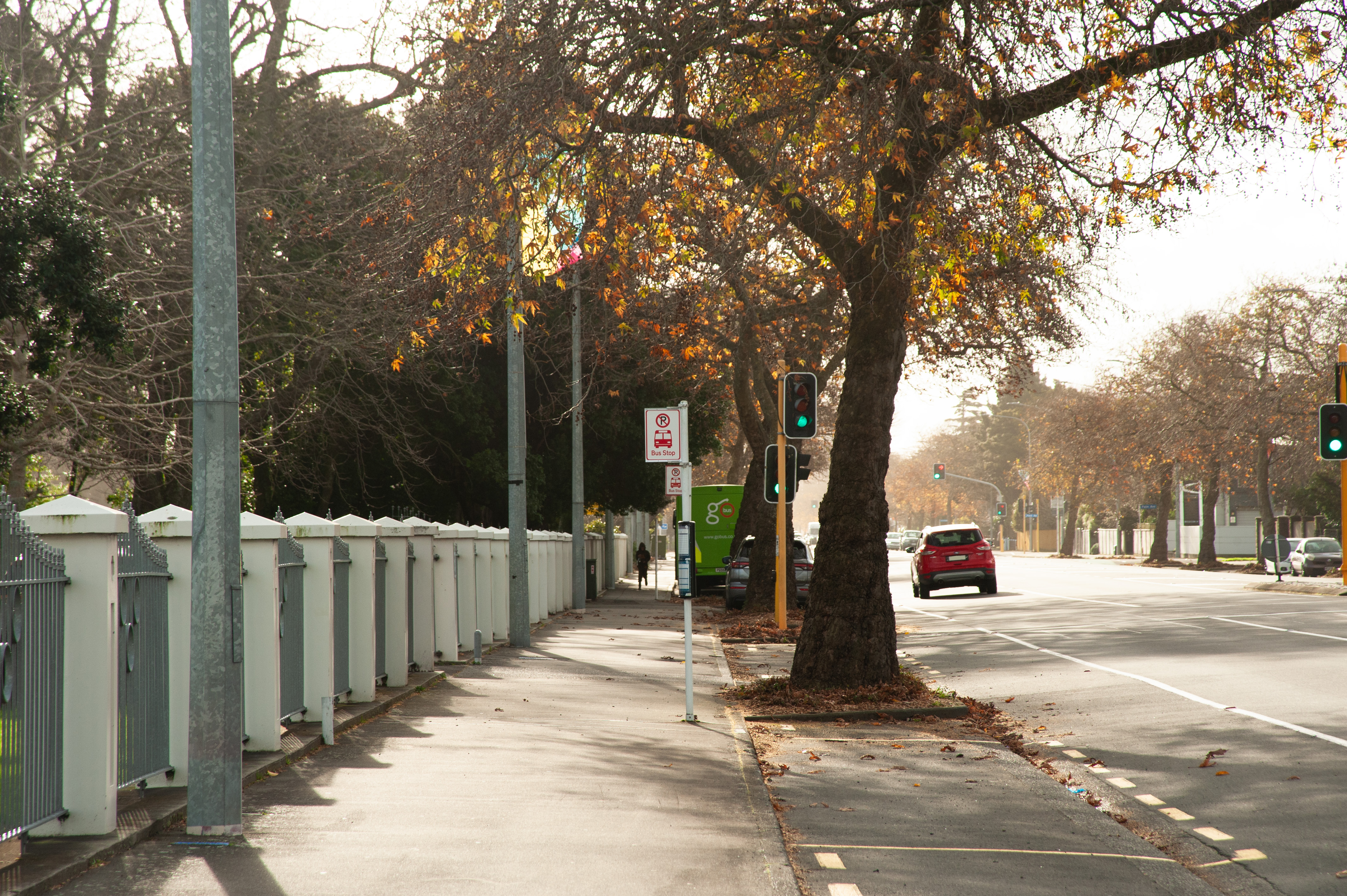 People cleaning up debris in a residential area after severe weather